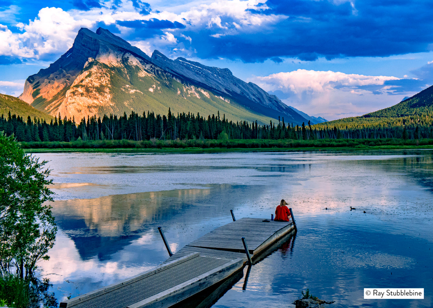2024-07-18 Woman in red sits on dock in Banff 27517b RFS22564-2xfinal