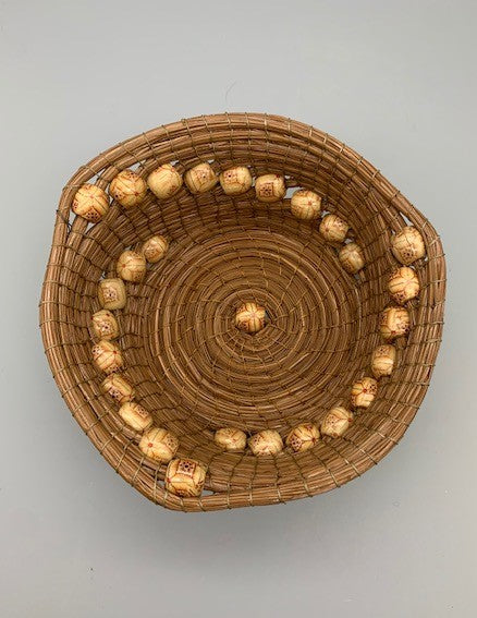 Nina Buzby- round basket with tan bead spirals